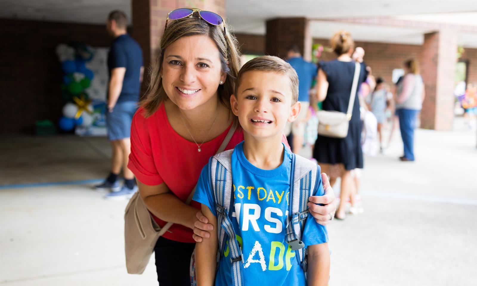 A mother and son smile